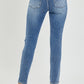 Risen Knee Distressed Skinny Jeans