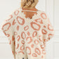Distressed Trim Leopard Vneck Sweater